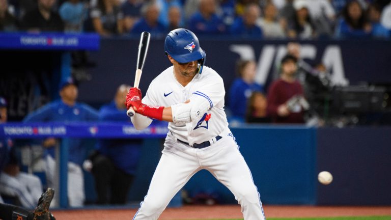 Toronto Blue Jays second baseman Whit Merrifield (15) hits a single running in Toronto Blue Jays first baseman Vladimir Guerrero Jr. (27) during fourth inning AL MLB baseball action against the Toronto Blue Jays, in Toronto on Wednesday, April 12, 2023. (CP)