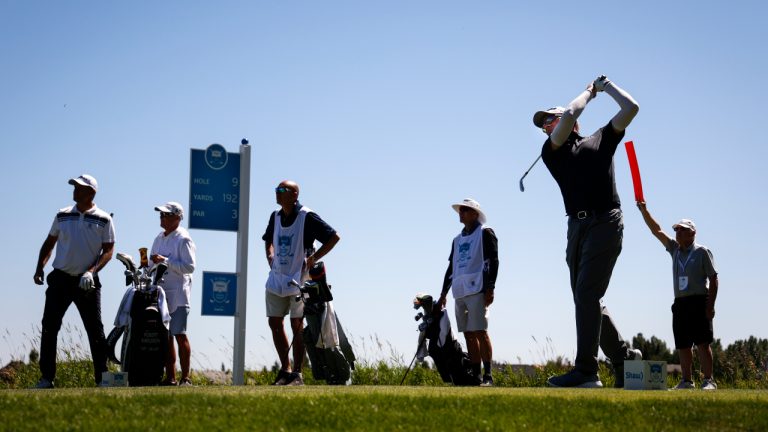John Huston, second right, of the United States, hits from the 9th tee during the PGA Tour Champions Shaw Charity Classic golf event in Calgary, Alta., Saturday, Aug. 6, 2022. (Jeff McIntosh/CP)