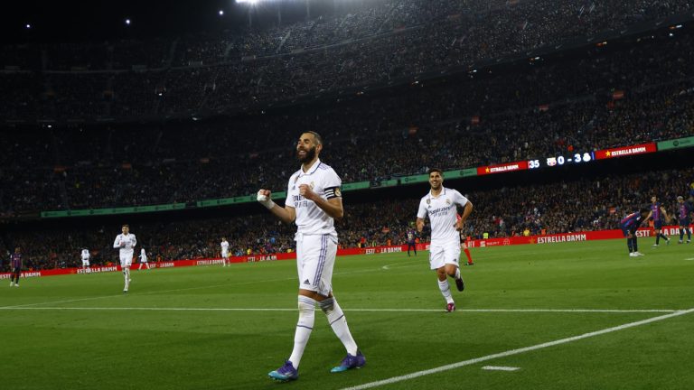 Real Madrid's Karim Benzema celebrates after scoring his side's fourth goal during the Spanish Copa del Rey semifinal, second leg soccer match between Barcelona and Real Madrid at the Camp Nou stadium in Barcelona, Spain, Wednesday, April 5, 2023. (Joan Monfort/AP)
