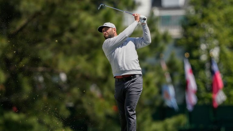Jon Rahm, of Spain, hits from the fairway on the first hole during the final round of the Masters golf tournament at Augusta. (David J. Phillip/AP)