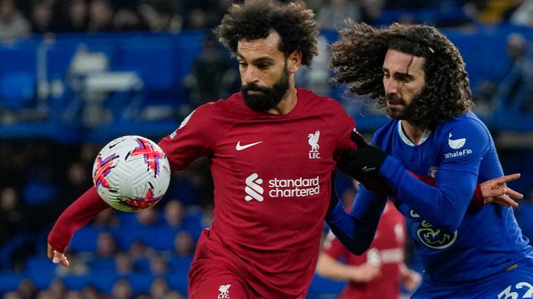 Liverpool's Mohamed Salah, left, duels for the ball with Chelsea's Marc Cucurella during the English Premier League soccer match between Chelsea and Liverpool at Stamford Bridge stadium in London, Tuesday, April 4, 2023. (Frank Augstein/AP)