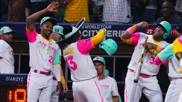San Diego Padres' Manny Machado (13) celebrates with teammates after hitting a two-run home run against the San Francisco Giants during the seventh inning of a baseball game at Alfredo Harp Helu Stadium in Mexico City, Saturday, April 29, 2023. (Fernando Llano/AP)