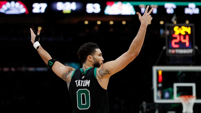 Boston Celtics' Derrick White reacts after a 3-pointer by Al Horford against the Toronto Raptors during the first half of an NBA basketball game Friday, April 7, 2023, in Boston. (Michael Dwyer/AP)
