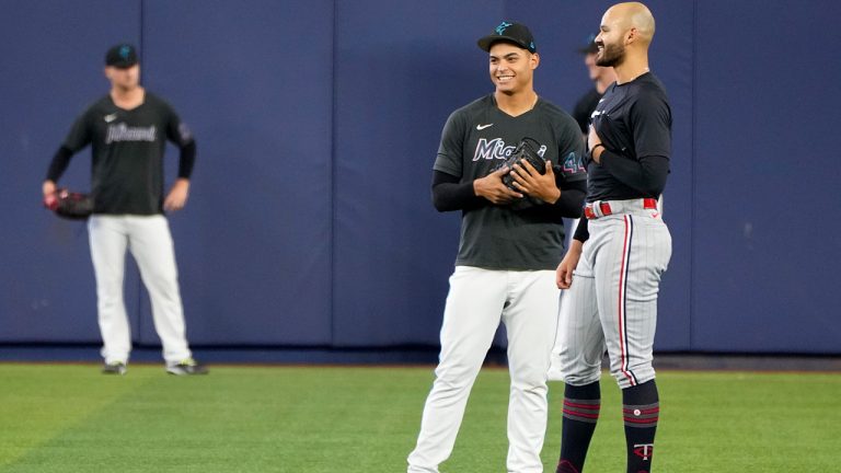 Miami Marlins pitcher Jesus Luzardo, left, talks with Minnesota Twins pitcher Pablo Lopez before a baseball game, Tuesday, April 4, 2023, in Miami. The two pitchers are scheduled to start in Wednesday's game. Lopez formerly played for the Marlins. (Lynne Sladky/AP)