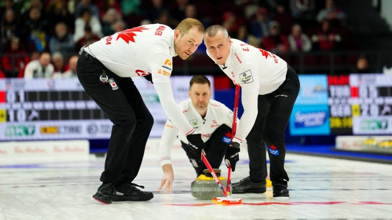 Canadian lead Geoff Walker, left, Canada second EJ Harnden sweep as they take on the Czech Republic at the Men's World Curling Championship in Ottawa on Tuesday, April 4, 2023. (Sean Kilpatrick/CP)