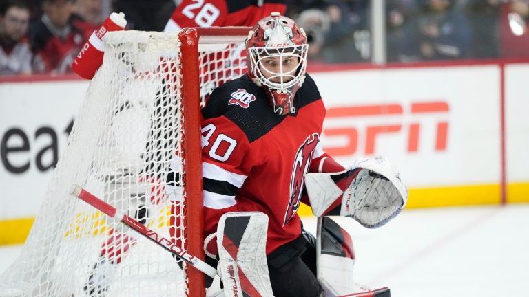 New Jersey Devils goaltender Akira Schmid watches the puck during the first period of Game 5 of the team's NHL hockey Stanley Cup first-round playoff series against the New York Rangers on Thursday, April 27, 2023, in Newark, N.J. (Frank Franklin II/AP Photo)