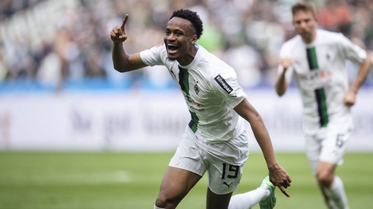 Gladbach's Nathan N'Goumou celebrates after scoring his side's first goal, during the Bundesliga soccer match between Borussia Mönchengladbach and VfL Wolfsburg. (Marius Becker/AP)
