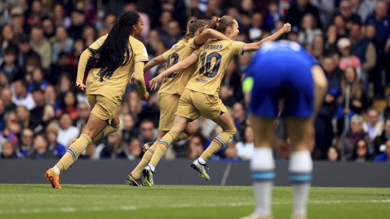 Barcelona's Caroline Graham Hansen, centre right celebrates with teammates after scoring the opening goal during the Women's Champions League semi-final first leg soccer match between Chelsea and Barcelona, at Stamford Bridge, London, Saturday April 22, 2023. (AP)