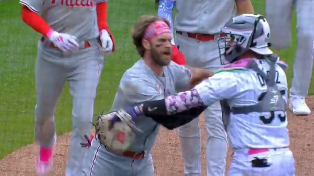 Phillies' Bryce Harper ejected after charging Rockies dugout