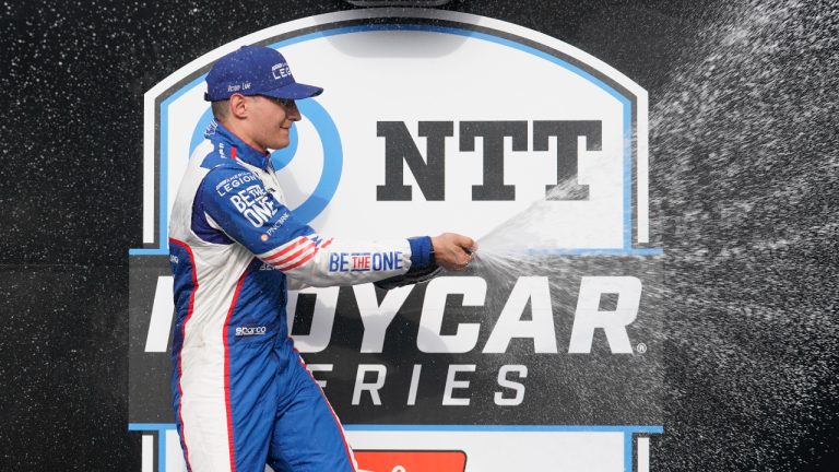Alex Palou, of Spain, celebrates after winning the IndyCar Grand Prix auto race at Indianapolis Motor Speedway, Saturday, May 13, 2023, in Indianapolis. (Darron Cummings/AP)