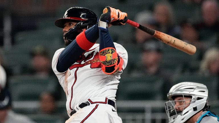 Atlanta Braves' Ronald Acuna Jr. follows through on a solo home run next to Miami Marlins catcher Jacob Stallings during the sixth inning of a baseball game Wednesday, April 26, 2023, in Atlanta. (AP)