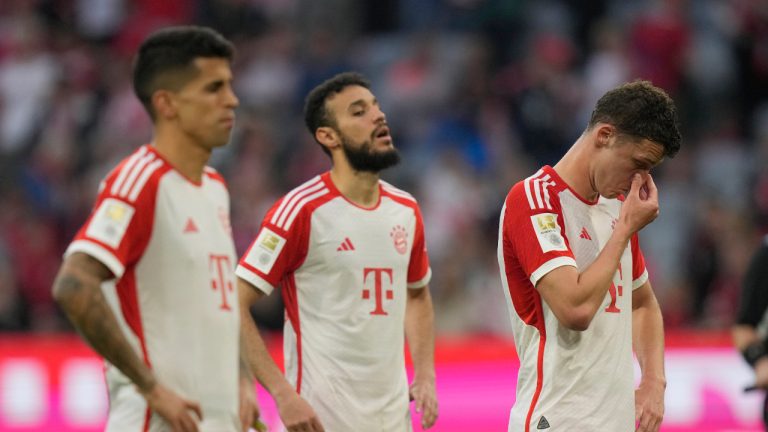 Bayern Munich players react to their loss at the end of the German Bundesliga soccer match between FC Bayern Munich and RB Leipzig at the Allianz Arena stadium in Munich, Germany, Saturday, May 20, 2023. (Matthias Schrader/AP)