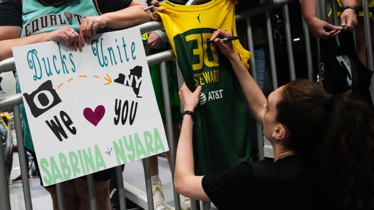 New York Liberty forward Breanna Stewart signs a jersey from her Seattle Storm days before a WNBA basketball game between the Liberty and the Storm, Tuesday, May 30, 2023, in Seattle. (Lindsey Wasson/AP)