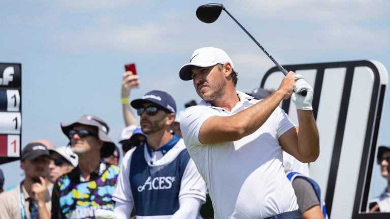 Captain Brooks Koepka of Smash GC hits his shot from the fifth tee during the first round of LIV Golf DC at the Trump National Golf Club Washington DC on Friday, May 26, 2023 in Sterling, Virginia. (Photo by Hunter Martin/LIV Golf via AP)