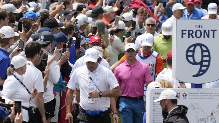 Rory McIIroy (pink shirt) makes his way through the crowd on his way to the second green during the fourth round of the Canadian Open in Toronto on Sunday, June 12, 2022. THE CANADIAN PRESS/Frank Gunn