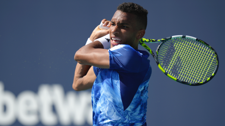 Felix Auger Aliassime, of Canada, returns a volley against Thiago Monteiro, of Brazil, in the first set of a match at the Miami Open tennis tournament, Saturday, March 25, 2023, in Miami Gardens, Fla. (AP Photo/Jim Rassol)