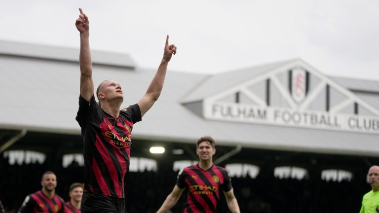 Manchester City's Erling Haaland celebrates after scoring the opening goal from the penalty spot during the English Premier League soccer match between Fulham and Manchester City at Craven Cottage in London, Sunday, April 30, 2023. City won the game 2-1. (Kin Cheung/AP)