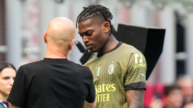 AC Milan's Rafael Leao leaves the pitch after an injury during a Serie A soccer match between AC Milan and Lazio, at the San Siro stadium in Milan, Italy, Saturday, May 6, 2023. (Luca Bruno/AP)