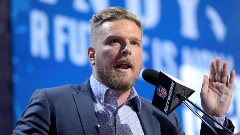 FILE - Former Indianapolis Colts player Pat McAfee announces the Colts' third round pick at the NFL football draft, April 26, 2019, in Nashville, Tenn. Retired NFL quarterback Brett Favre is dismissing his lawsuit against McAfee after McAfee publicly apologized for his previous on-air statements that Favre had been “stealing from poor people in Mississippi” in a welfare misspending case. Favre and McAfee both announced the settlement Thursday, May 11, 2023. (AP Photo/Gregory Payan, File)