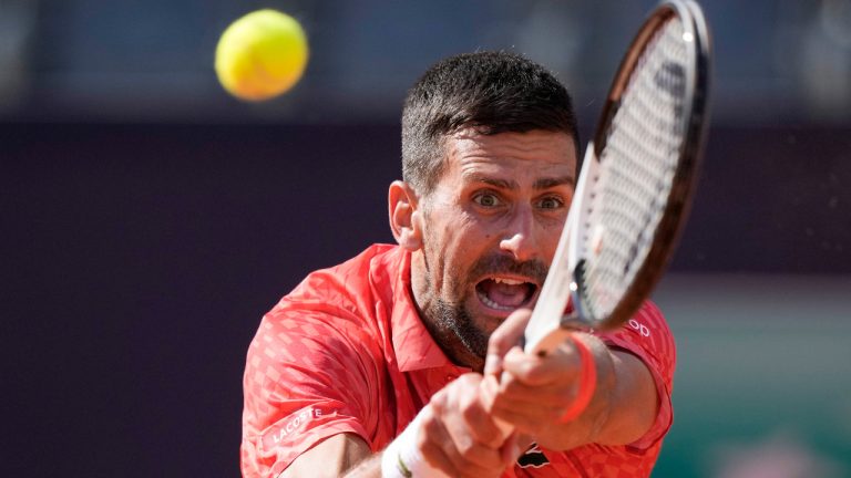 Novak Djocovic returns the ball to Grigor Dimitrov at the Italian Open tennis tournament, in Rome, Sunday, May 14, 2023. (Andrew Medichini/AP) 