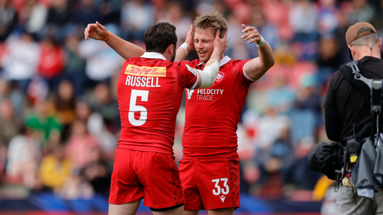 Alex Russell and Kalin Sager celebrate Canada’s cup quarter-final win over Australia on Day 2 of the HSBC France Sevens on Saturday, May 13, 2023, at Stade Toulousa in Toulouse, France. (CP/HO-World Rugby-Mike Lee)