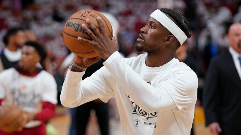 Miami Heat forward Jimmy Butler (22) watts up before Game 3 of the NBA basketball playoffs Eastern Conference finals against the Boston Celtics, Sunday, May 21, 2023, in Miami. (Wilfredo Le/AP ) 