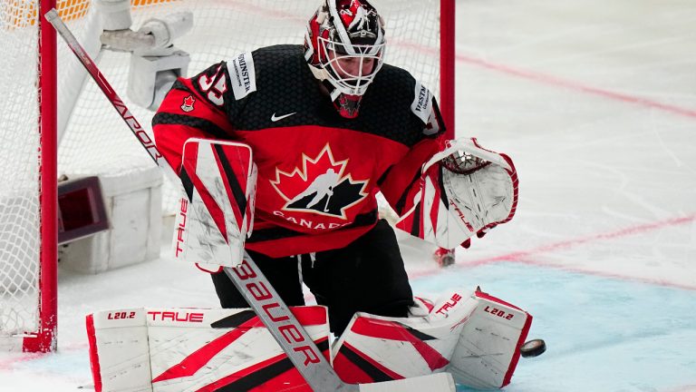 Canada's goalie Samuel Montembeault (35) cannot stop the puck on a goal by Germany's John Peterka during the gold medal match at the Ice Hockey World Championship in Tampere, Finland, Sunday, May 28, 2023. (Pavel Golovkin/AP)