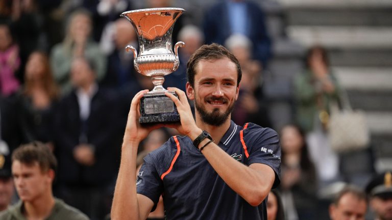 Daniil Medvedev of Russia lifts the trophy after defeating Denmark's Holger Rune during the men's final tennis match at the Italian Open tennis tournament in Rome, Italy, Sunday, May 21, 2023. (Alessandra Tarantino/AP)
