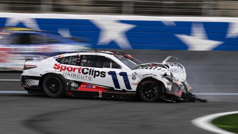 Denny Hamlin (11) crashes on the front stretch during a NASCAR Cup Series auto race at Charlotte Motor Speedway, Monday, May 29, 2023, in Concord, N.C. (Matt Kelley/AP)