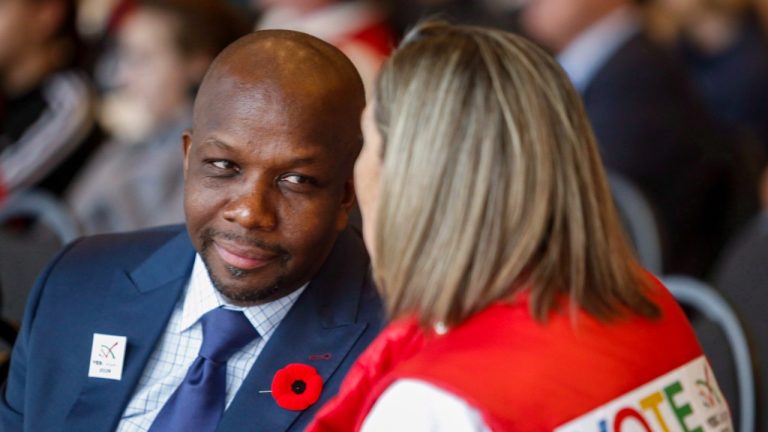 Former Canadian Olympic sprinter Donovan Bailey is joining the bid led by Los Angeles-based produce Neko Sparks to buy the NHL's Ottawa Senators, the 55-year-old announced on Twitter. Bailey, centre left, speaks to a fan during a rally in support of the 2026 Winter Olympic bid in Calgary, Alta., Monday, Nov. 5, 2018. THE CANADIAN PRESS/Jeff McIntosh