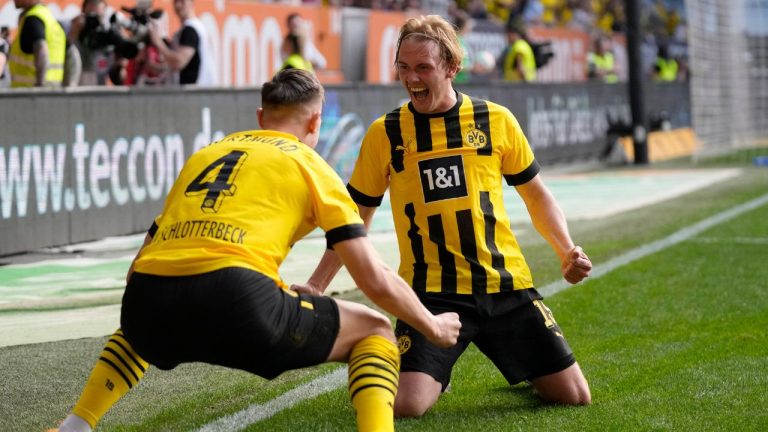 Dortmund's Julian Brandt celebrates after scoring his side's third goal during the German Bundesliga soccer match between FC Augsburg and Borussia Dortmund at the WWK Arena in Augsburg, Germany, Sunday, May 21, 2023. (Matthias Schrader/AP Photo)