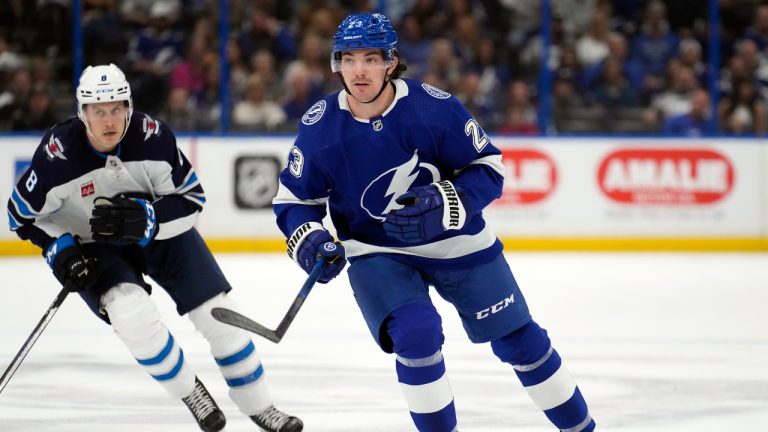 Tampa Bay Lightning centre Michael Eyssimont (23) skates around Winnipeg Jets right wing Saku Maenalanen (8) during the first period of an NHL hockey game Sunday, March 12, 2023, in Tampa, Fla. (Chris O'Meara/AP)