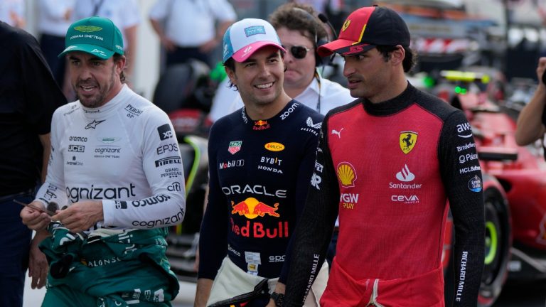 First place finisher, Red Bull driver Sergio Perez of Mexico, center, walks with second place finisher Aston Martin driver Fernando Alonso of Spain, left, and third place finisher Ferrari driver Carlos Sainz of Spain, at the end of the qualifying session of the Formula One Miami Grand Prix auto race, at Miami International Autodrome in Miami Gardens, Fla., Saturday, May 6, 2023. (Rebecca Blackwell/AP)
