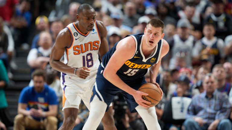 Denver Nuggets centre Nikola Jokic (15) and Phoenix Suns centre Bismack Biyombo (18) in the second half of Game 2 of an NBA second-round playoff series Monday, May 1, 2023, in Denver. (David Zalubowski/AP)