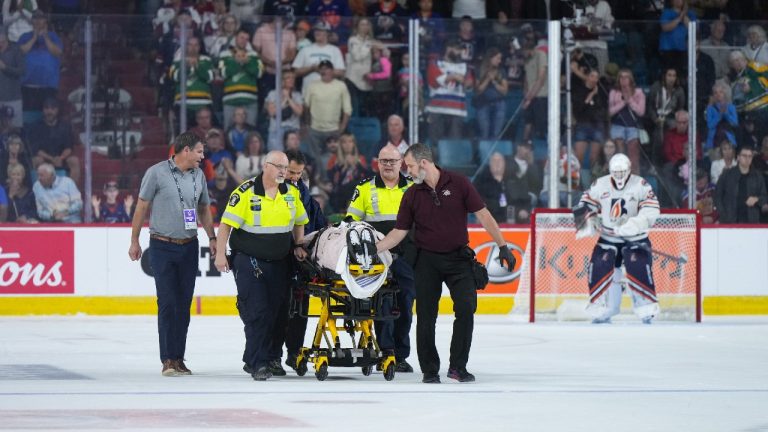 Kamloops Blazers' Kyle Masters is taken off the ice on a stretcher after a collision with Peterborough Petes' Chase Stillman during third period Memorial Cup hockey action, in Kamloops, B.C., on Sunday, May 28, 2023. (Darryl Dyck/CP)