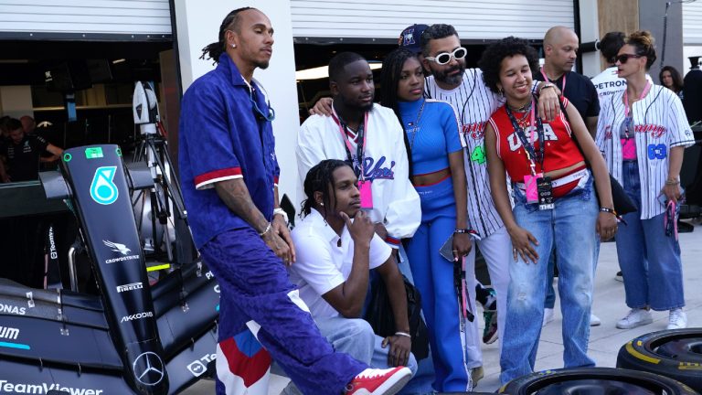 Mercedes driver Lewis Hamilton, left, of Britain, poses for a photo with A$AP Rocky, second from left, in pit lane ahead of the Formula One Miami Grand Prix auto race at Miami International Autodrome, Thursday, May 4, 2023, in Miami Gardens, Fla. (Lynne Sladky/AP)