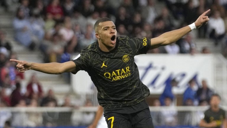 PSG's Kylian Mbappe celebrates after scoring his side's second goal during the French League One soccer match between Auxerre and Paris Saint Germain, at the Abbe Deschamps stadium in Auxerre, central France, Sunday, May 21, 2023. (Thibault Camus/AP)
