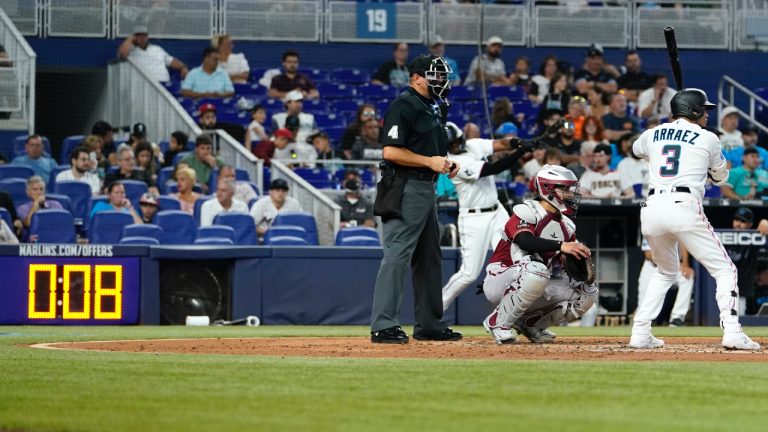 The pitch clock runs as Miami Marlins' Luis Arraez (3) bats during a baseball game against the Arizona Diamondbacks, Sunday, April 16, 2023, in Miami. (Lynne Sladky/AP)