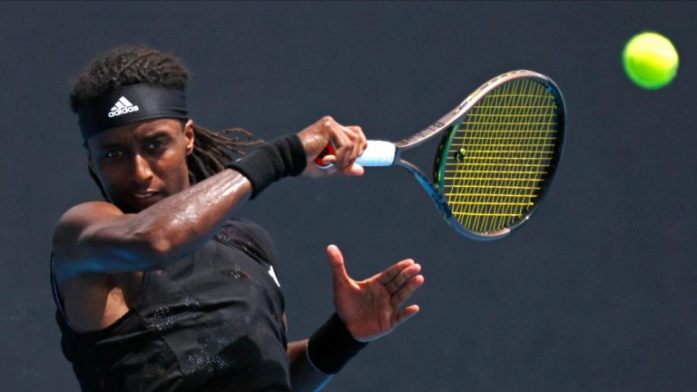 Mikael Ymer of Sweden plays a forehand return to Yoshihito Nishioka of Japan during their first round match at the Australian Open tennis championship in Melbourne, Australia, Monday, Jan. 16, 2023. (Asanka Brendon Ratnayake/AP)