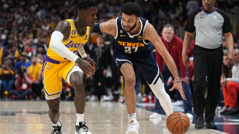 Denver Nuggets guard Jamal Murray (27) drives as Los Angeles Lakers guard Dennis Schroder defends during the second half of Game 2 of the NBA basketball Western Conference Finals series, Thursday, May 18, 2023, in Denver. (Jack Dempsey/AP)