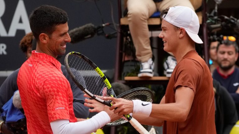 Denmark's Holger Rune celebrates after winning the quarter final match against Serbia's Novak Djokovic at the Italian Open tennis tournament, in Rome, Wednesday, May 17, 2023. (Gregorio Borgia/AP)