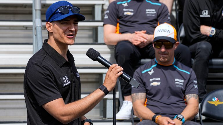 Alex Palou, of Spain, speaks as Tony Kanaan, of Brazil, looks on during the drivers meeting for the Indianapolis 500 auto race at Indianapolis Motor Speedway in Indianapolis, Saturday, May 27, 2023. (Darron Cummings/AP)
