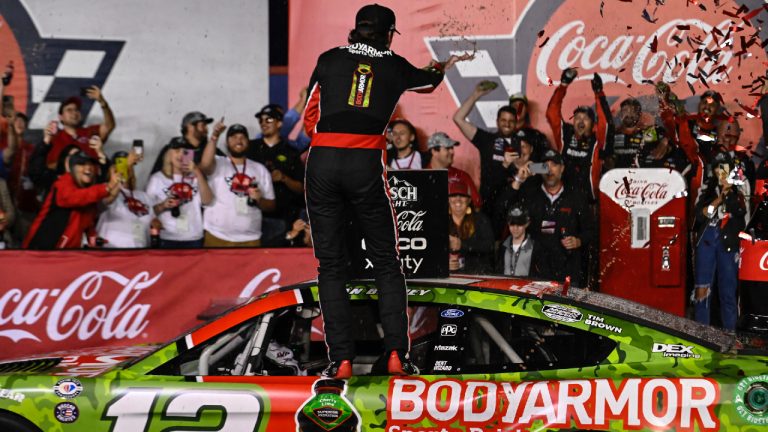 Ryan Blaney, centre, celebrates on his car in Victory Lane after winning a NASCAR Cup Series auto race at Charlotte Motor Speedway, Monday, May 29, 2023, in Concord, N.C. (Matt Kelley/AP)