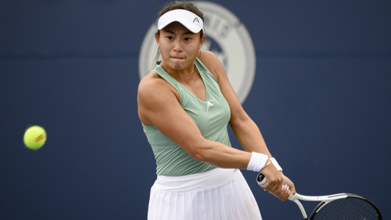 Carol Zhao, of Canada, returns the ball during a match against Amanda Anisimova, of the USA, at the National Bank Open tennis tournament in Toronto, on Tuesday, Aug. 9, 2022. Zhao advanced to the second round of the French Open women's qualifying tournament with a 6-4, 5-7, 6-1 win over Poland's Katarzyna Kawa on Tuesday. THE CANADIAN PRESS/Christopher Katsarov