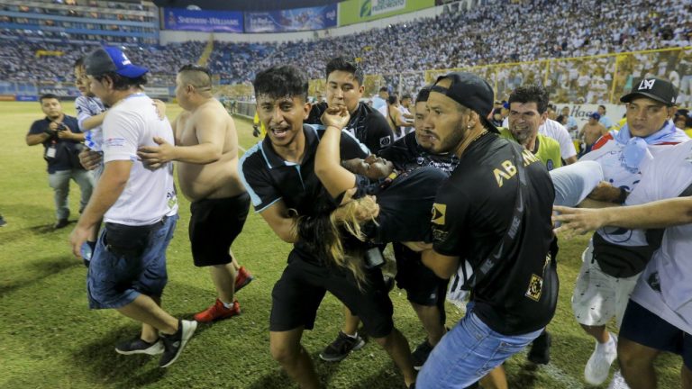 An injured fan in carried to the field of Cuscatlan stadium in San Salvador, El Salvador, Saturday, May 20, 2023. At least nine people were killed and dozens more injured when stampeding fans pushed through one of the access gates at a quarterfinal Salvadoran league soccer match between Alianza and FAS. (Milton Flores/AP)