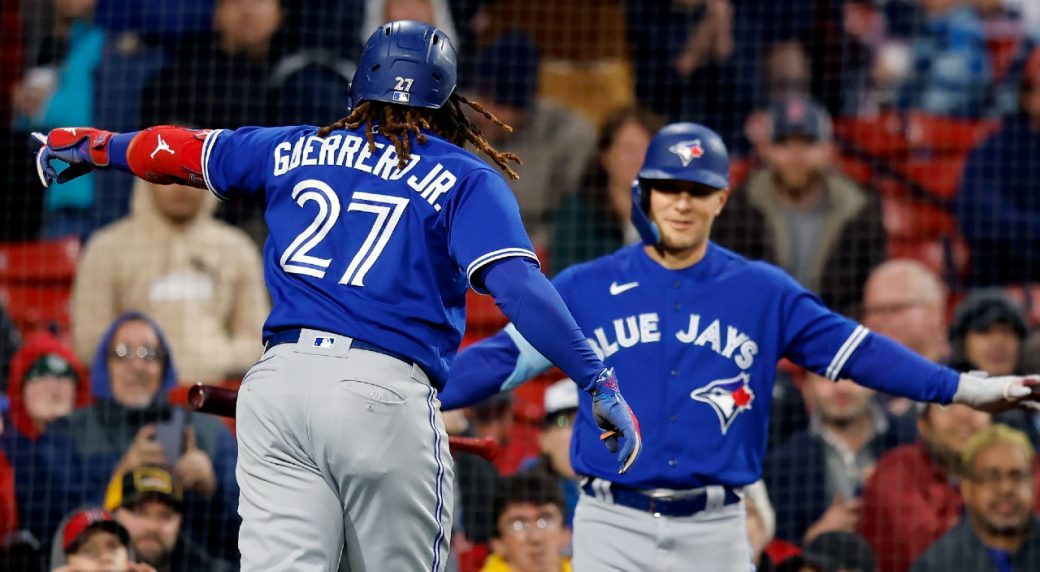 Red Sox light up Blue Jays pitching in win in rainy Boston