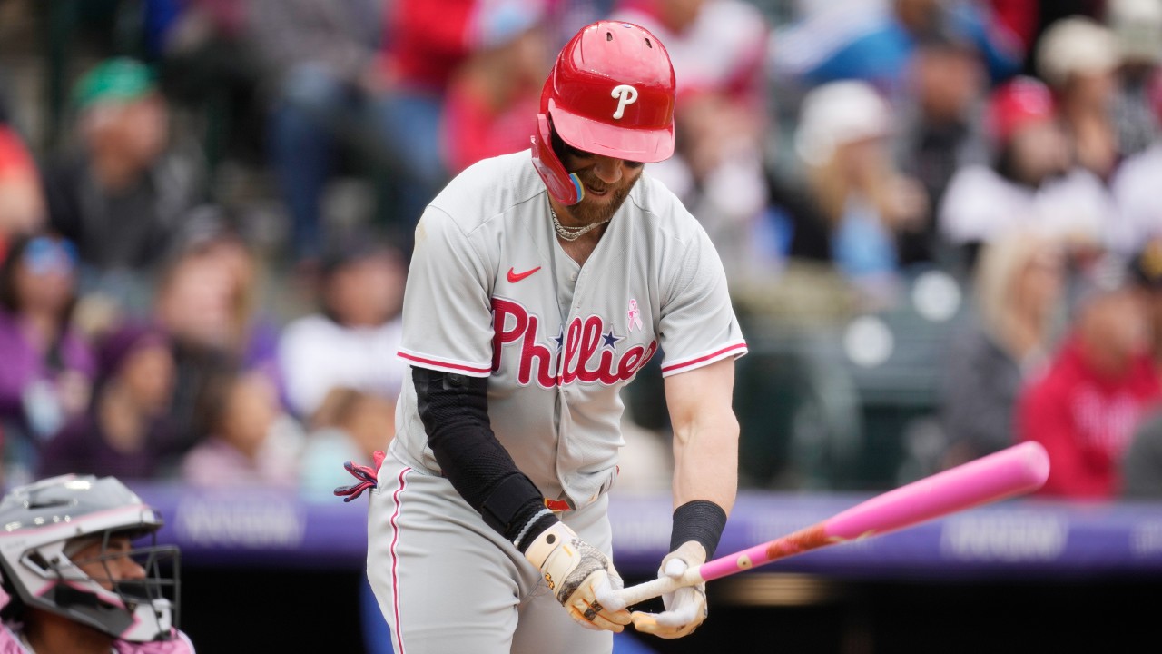 Phillies' Bryce Harper ejected after charging Rockies dugout 15 M...
