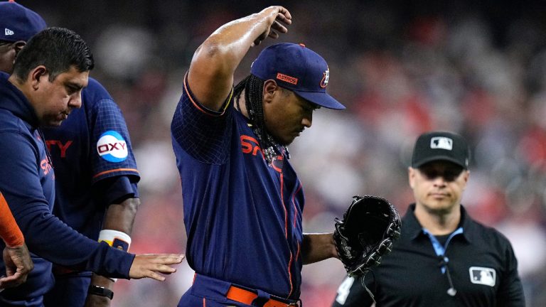 Houston Astros starting pitcher Luis Garcia exits after only throwing eight pitches during the first inning of a baseball game against the San Francisco Giants, Monday, May 1, 2023, in Houston. (Kevin M. Cox/AP)