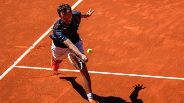 Daniil Medvedev, of Russia, returns the ball to Alexander Shevchenko, of Russia, at the Madrid Open. (Manu Fernandez/AP)