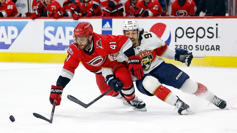 Carolina Hurricanes' Shayne Gostisbehere (41) tangles with Florida Panthers' Ryan Lomberg (94) during the third period of Game 1 of the NHL hockey Stanley Cup Eastern Conference finals in Raleigh, N.C., Thursday, May 18, 2023. (Karl B DeBlaker/AP Photo)